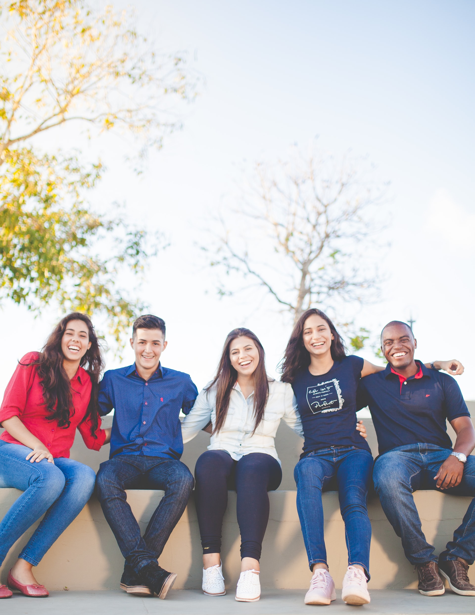 Group of friends sitting outdoors.